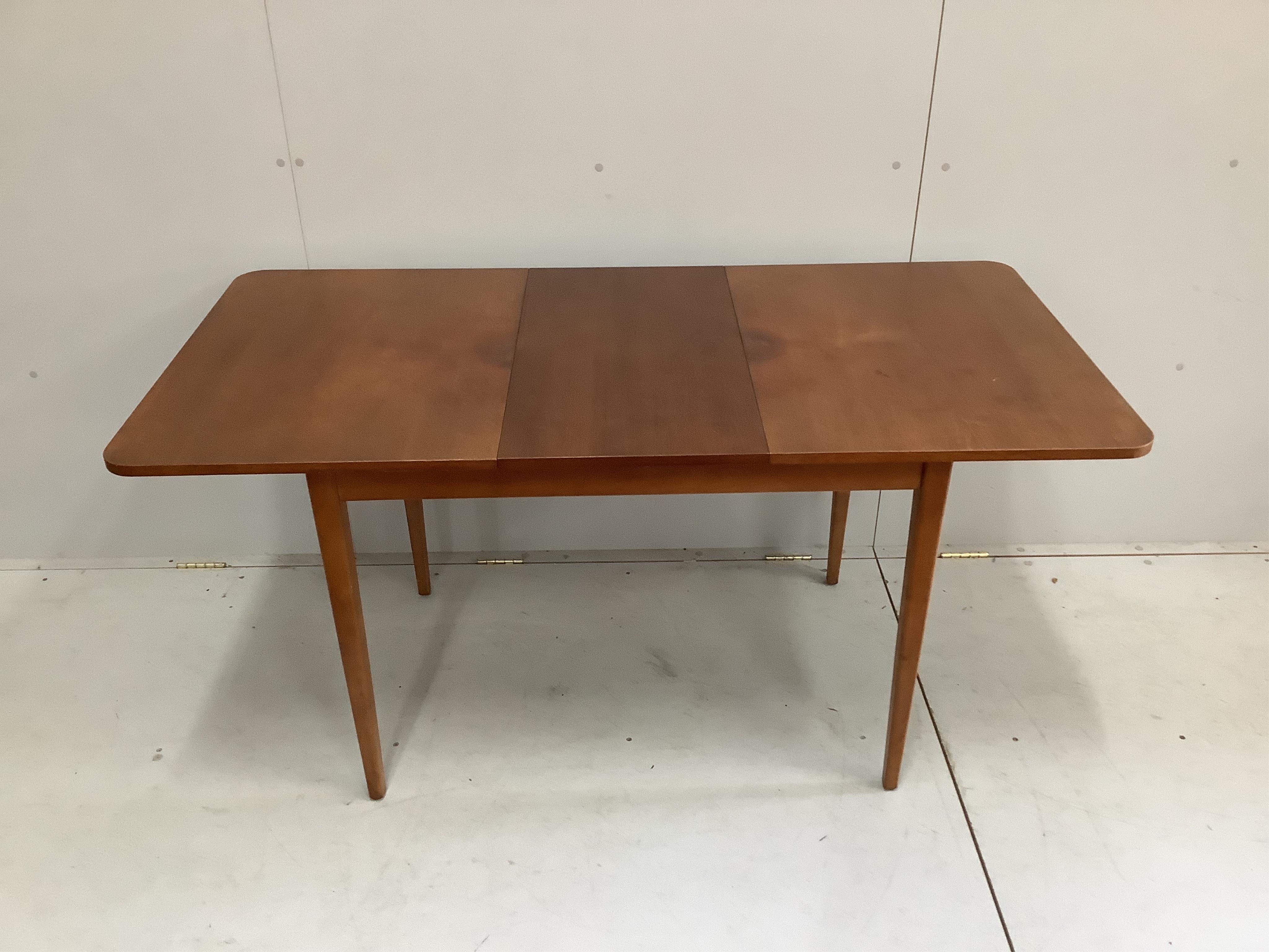 A mid century teak dining table and a set of four chairs. Condition - fair